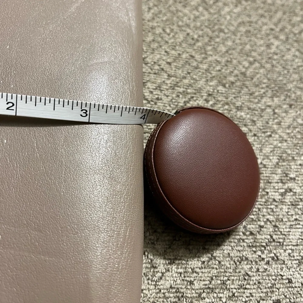 Coach wallet. Has some wear marks and wrinkles on outside of wallet.
